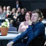 Karl sitting on a chair in an event